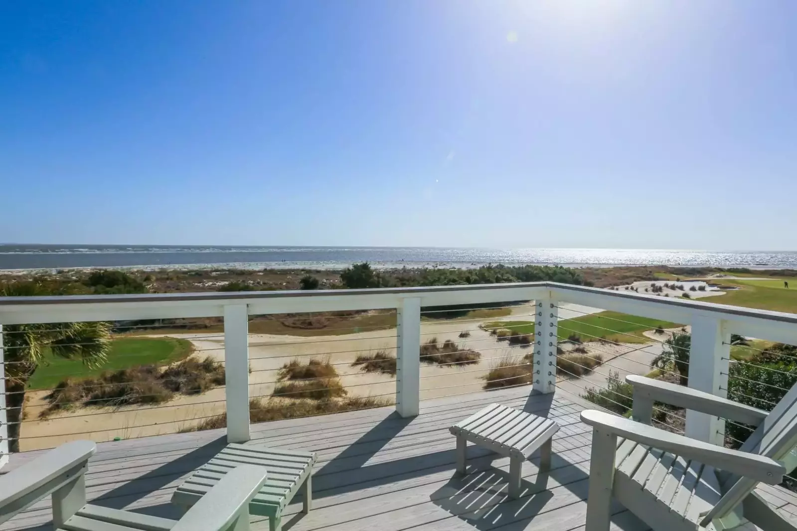 The balcony off of the master bedroom overlooks the ocean, sand dunes and the 18th hole of the Links golf course.