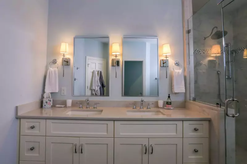 The en suite bathroom for the master bedroom has a double sink vanity.