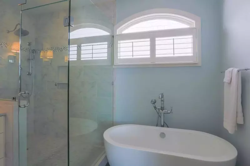 The en suite bathroom for the master bedroom also has a walk-in shower and soaking tub.