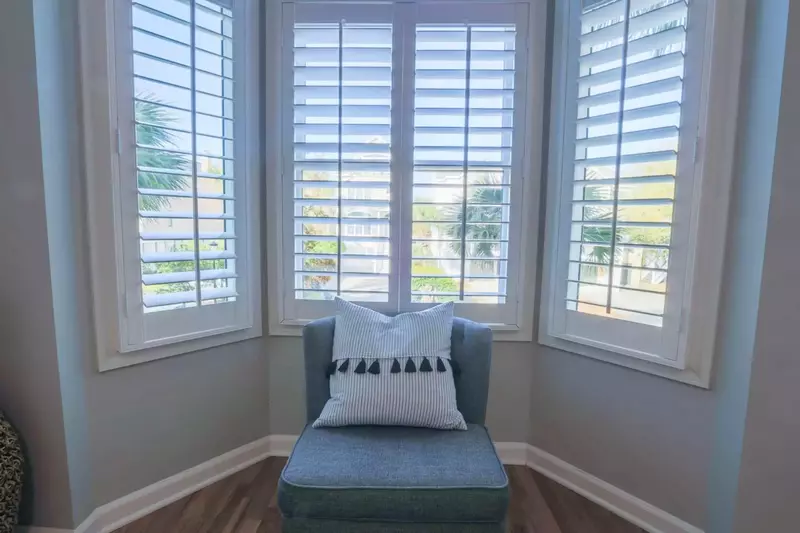 This ground floor guest bedroom looks out over the front side of the home.