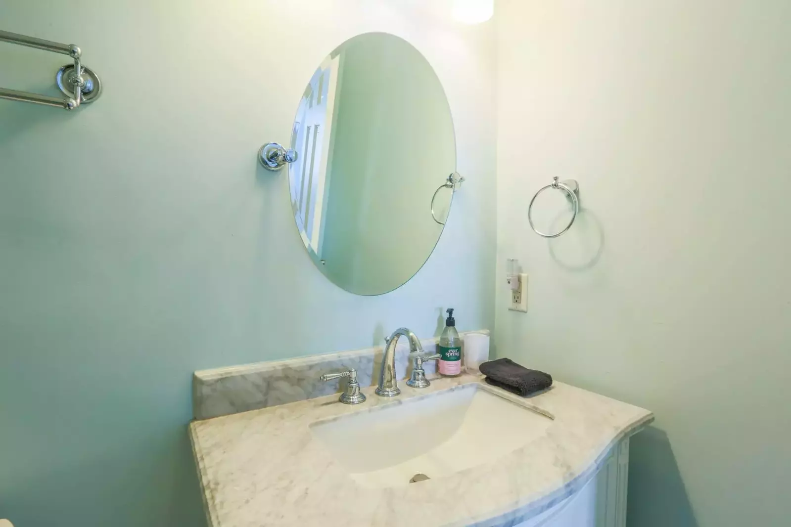 The en suite bathroom has a spacious vanity.