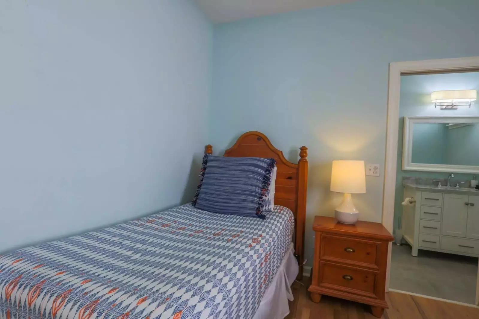 This guest bedroom also has an en suite bathroom.