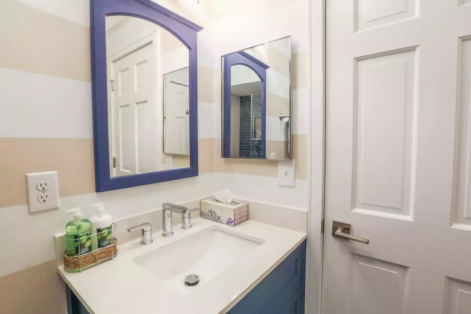 We love the blue vanity and blue mirror in the bathroom!