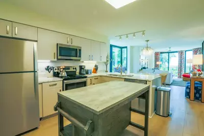 This updated and fully stocked kitchen is the perfect space to prepare meals after the beach!