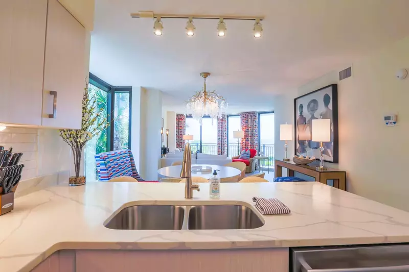 The open floor plan layout makes it very easy to interact with guests in the kitchen, dining room & living room areas.