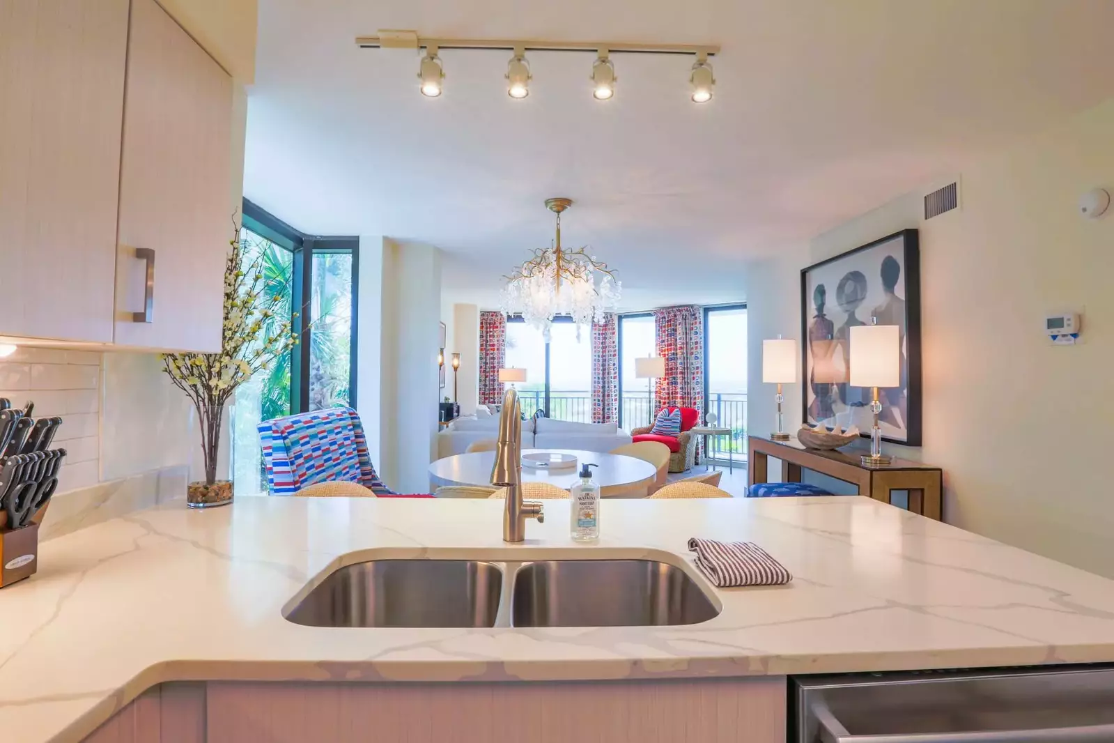 The open floor plan layout makes it very easy to interact with guests in the kitchen, dining room & living room areas.