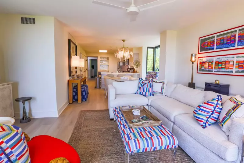 Hardwood floors run throughout the living room, dining room, kitchen and hallway.