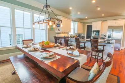Gigi's Beach House has an open floor plan layout between the kitchen, dining room and living room.