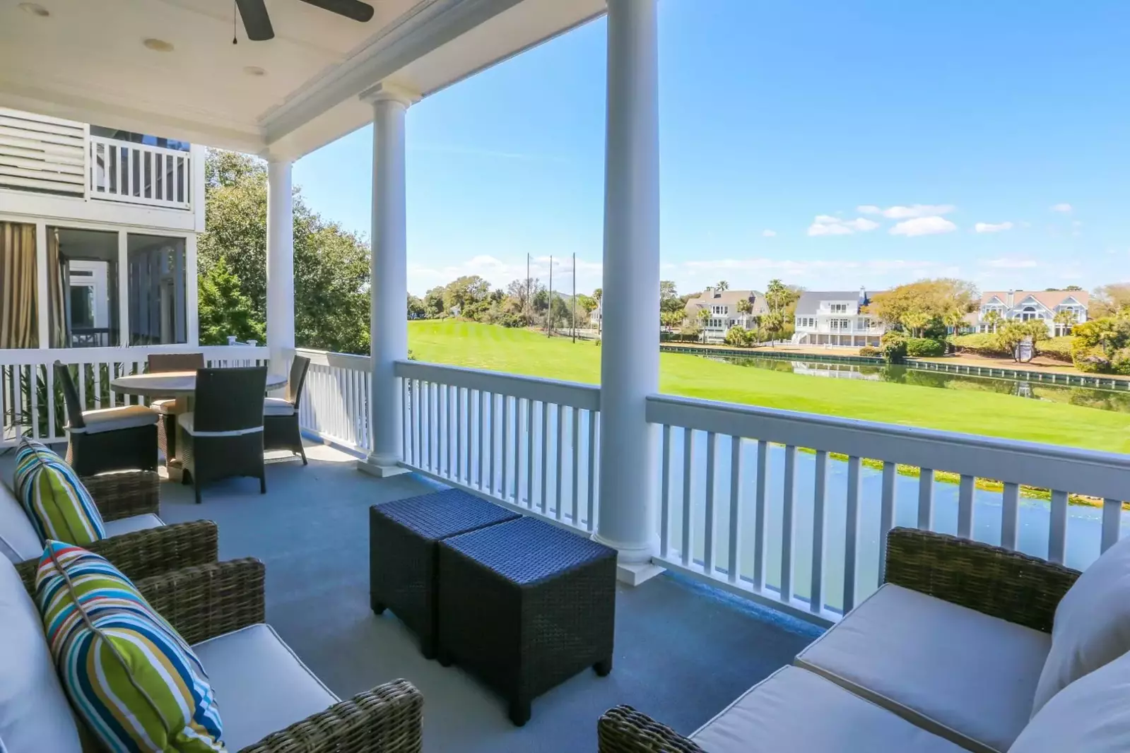 The covered porch off of the living room also features a comfortable seating area.