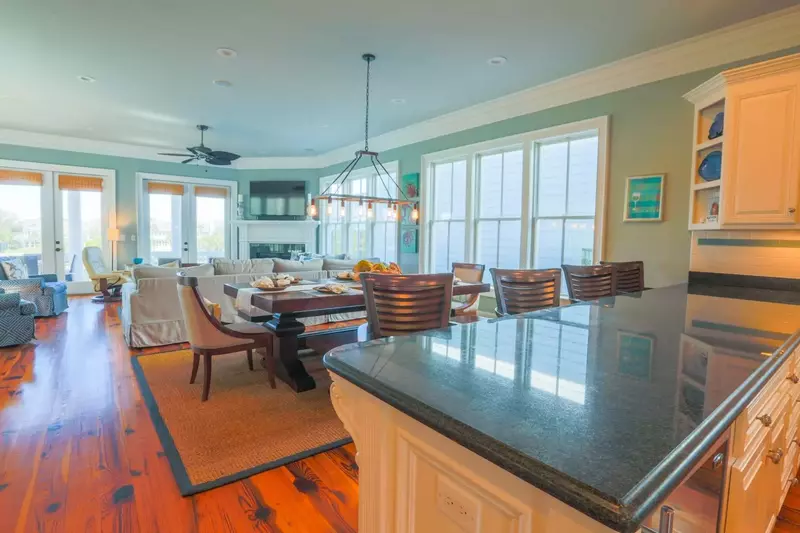 There is seating at the dining table for 8 and 4 additional stools at the kitchen counter.