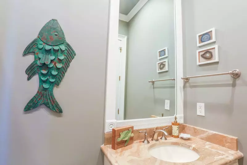This en suite bathroom has a marble-topped vanity.