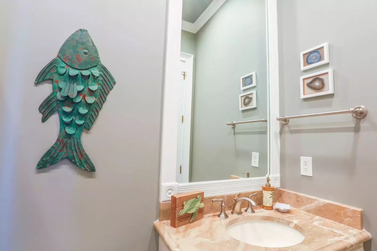 This en suite bathroom has a marble-topped vanity.