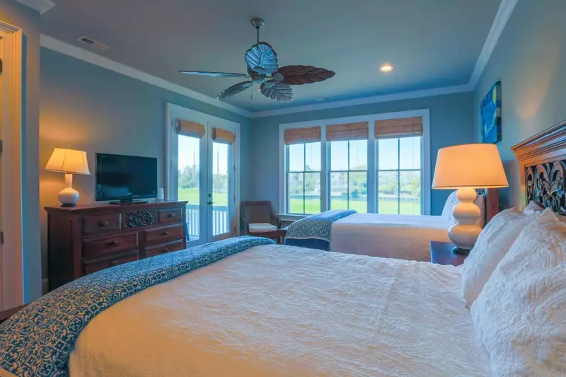 This bedroom also has French door access to a private, covered porch.