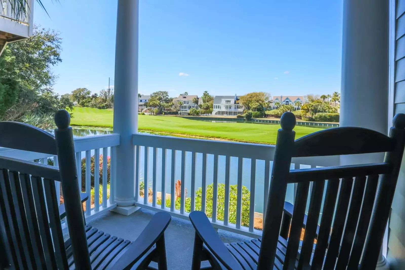 The covered porch for the first floor bedroom has two comfortable rocking chairs.