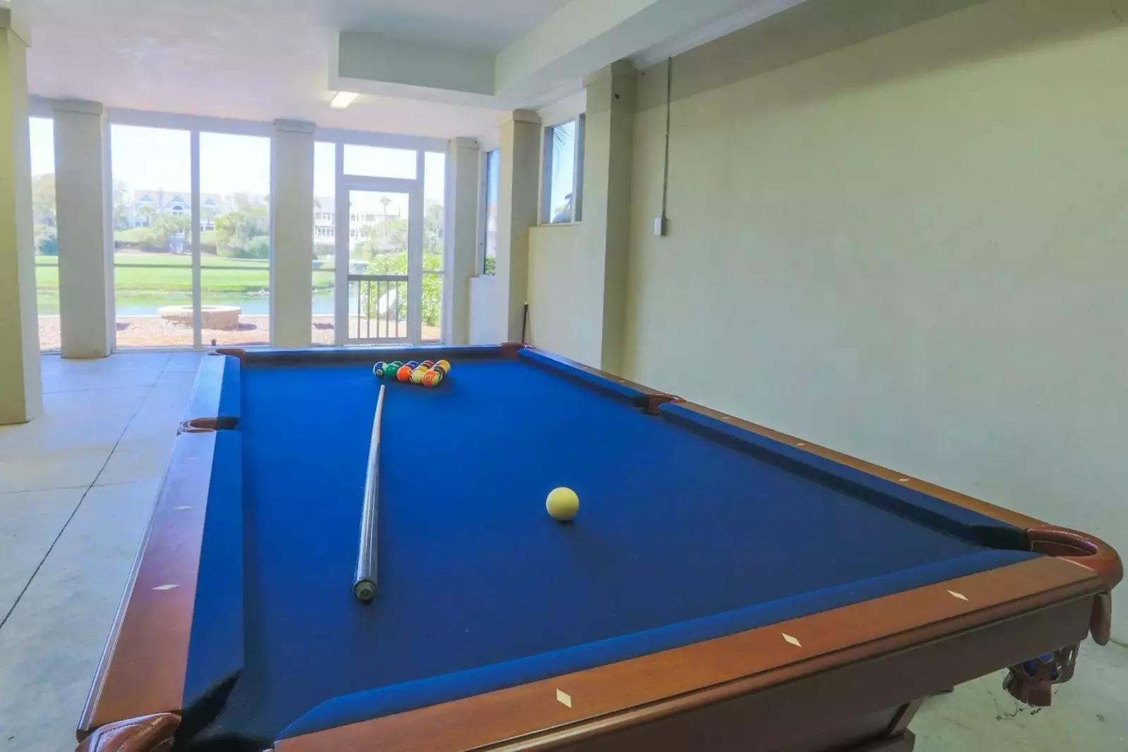 Remove the table's ping pong table top and the protective cover and you can play pool!