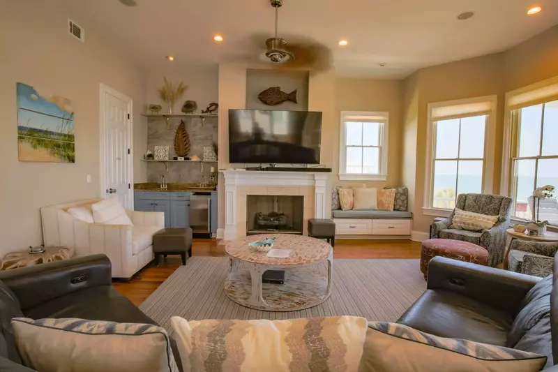 There is a wet bar and ice maker tucked away in the corner of the living room.