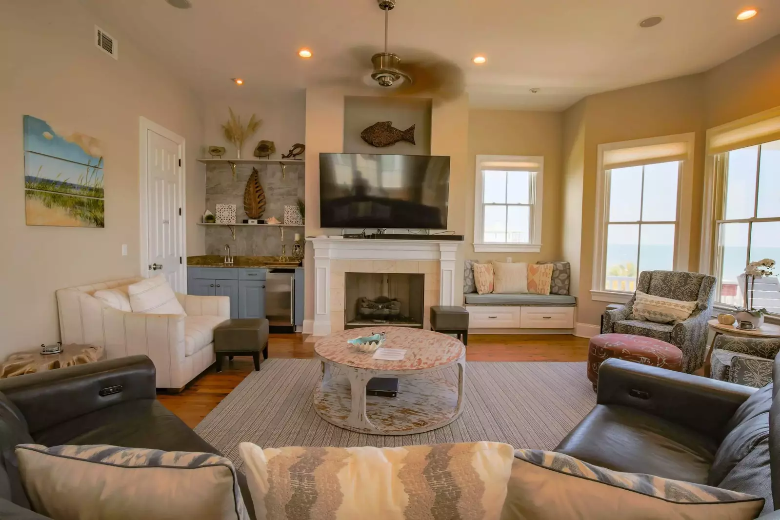 There is a wet bar and ice maker tucked away in the corner of the living room.