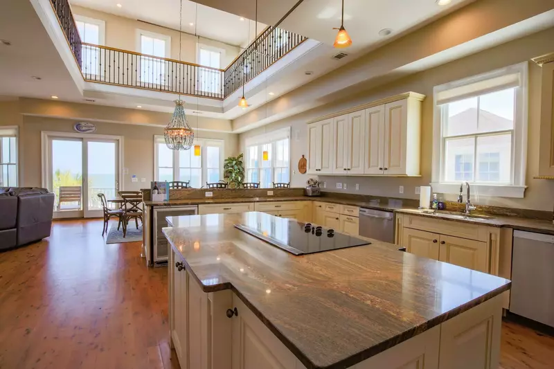 You'll also swoon over the hardwood floors and high ceilings in the kitchen, dining room and living room areas.