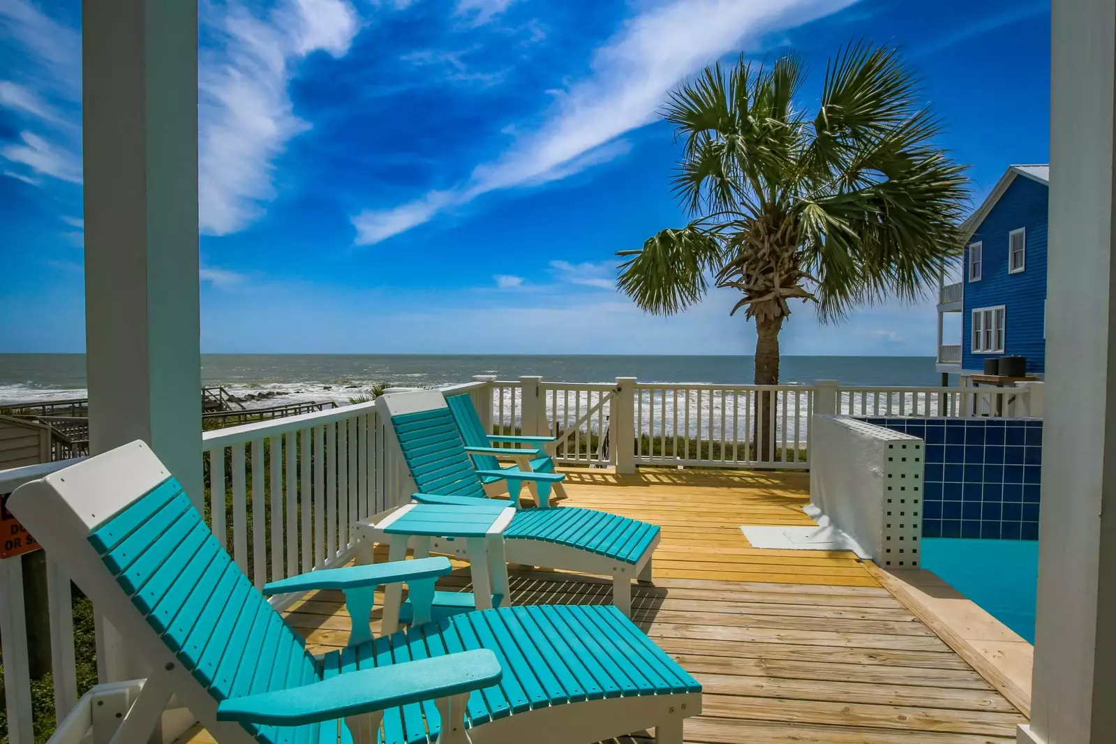 This gate on the back porch connects the home to the beach via a private boardwalk.