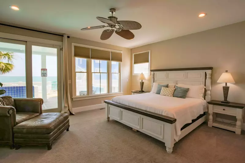 The master bedroom, which is located on the lowest level of the home, features a king bed.