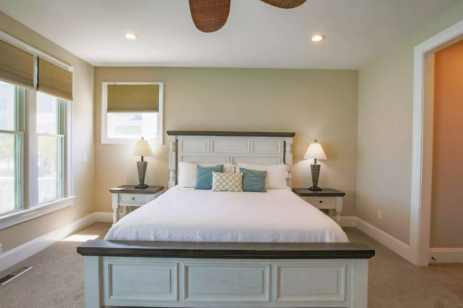 The spacious en suite bathroom is located just through the doorway on the right side of this photo.