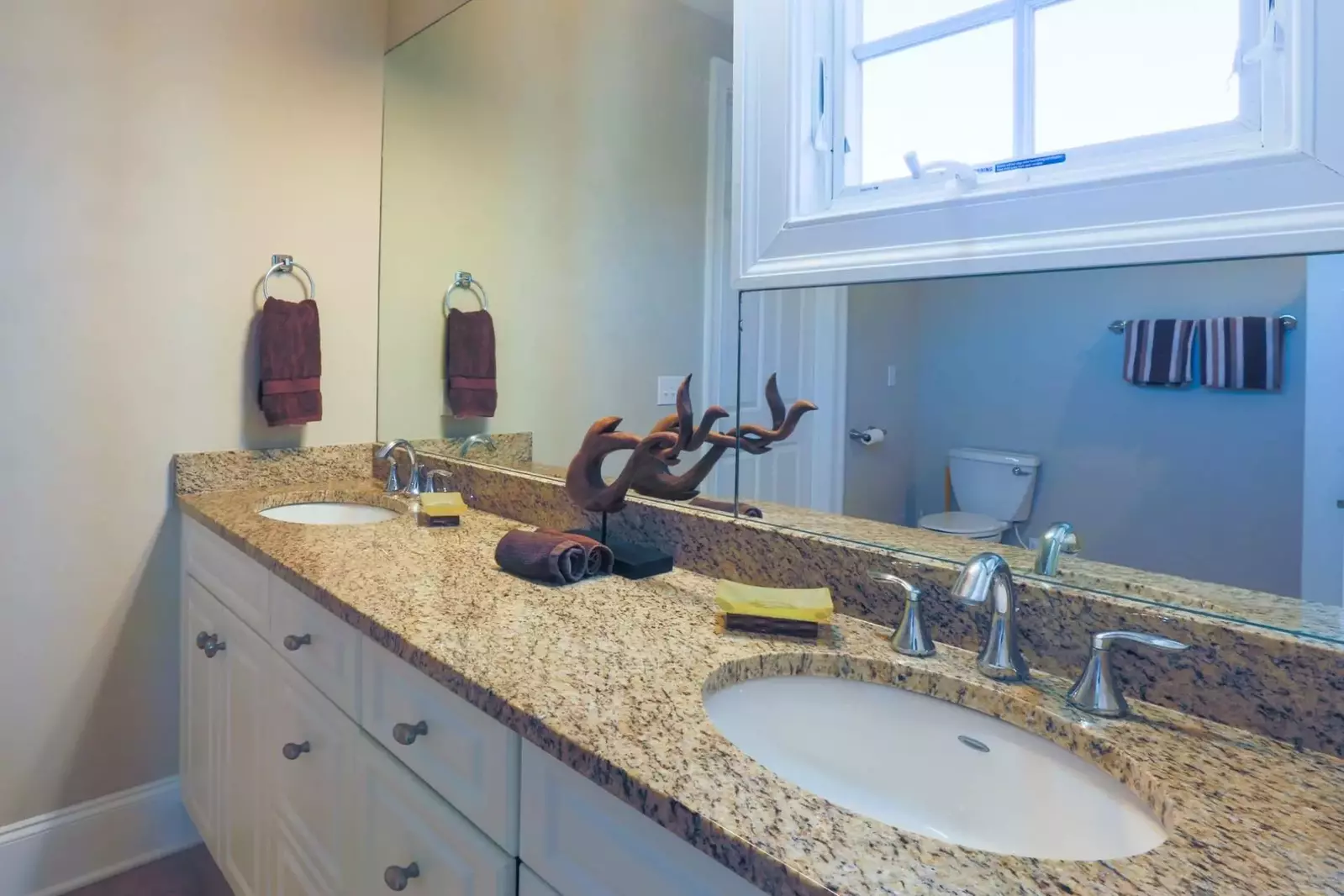 This jack & jill bathroom is shared by two bedrooms on the home's elevated first floor.