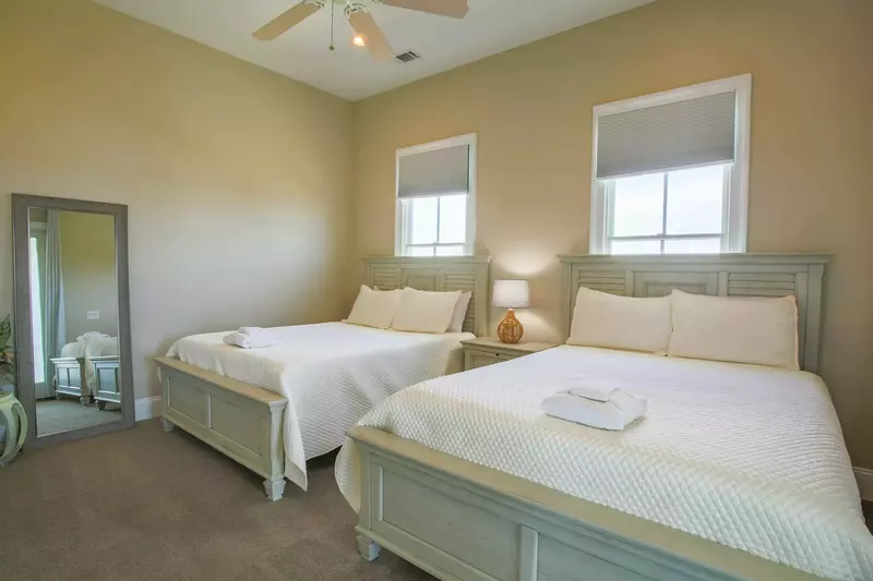 This bedroom is located on the home's second floor near the kitchen.