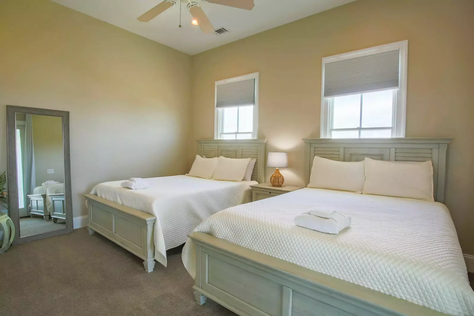 This bedroom is located on the home's second floor near the kitchen.