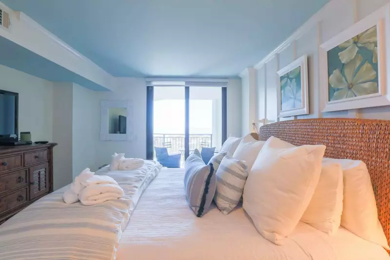 The master bedroom has incredible ocean views and sliding door access to the balcony.