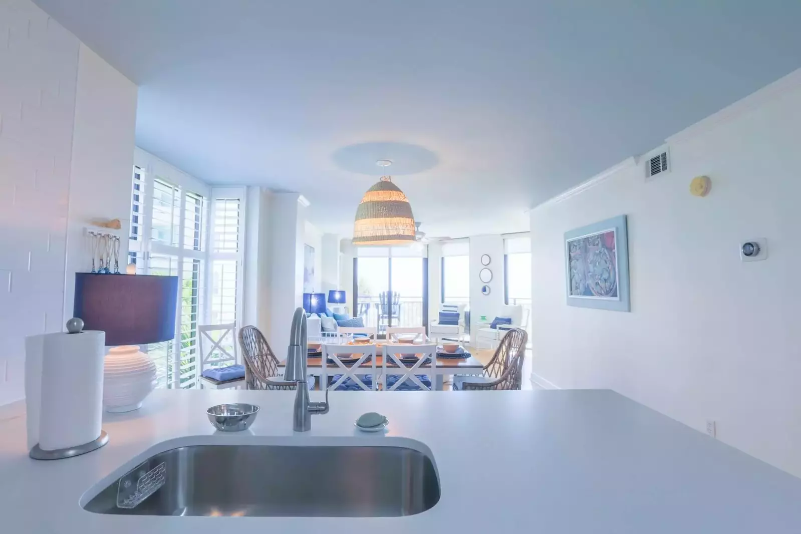 The open floor plan layout makes it very easy to interact with guests in the kitchen, dining area & living room areas.