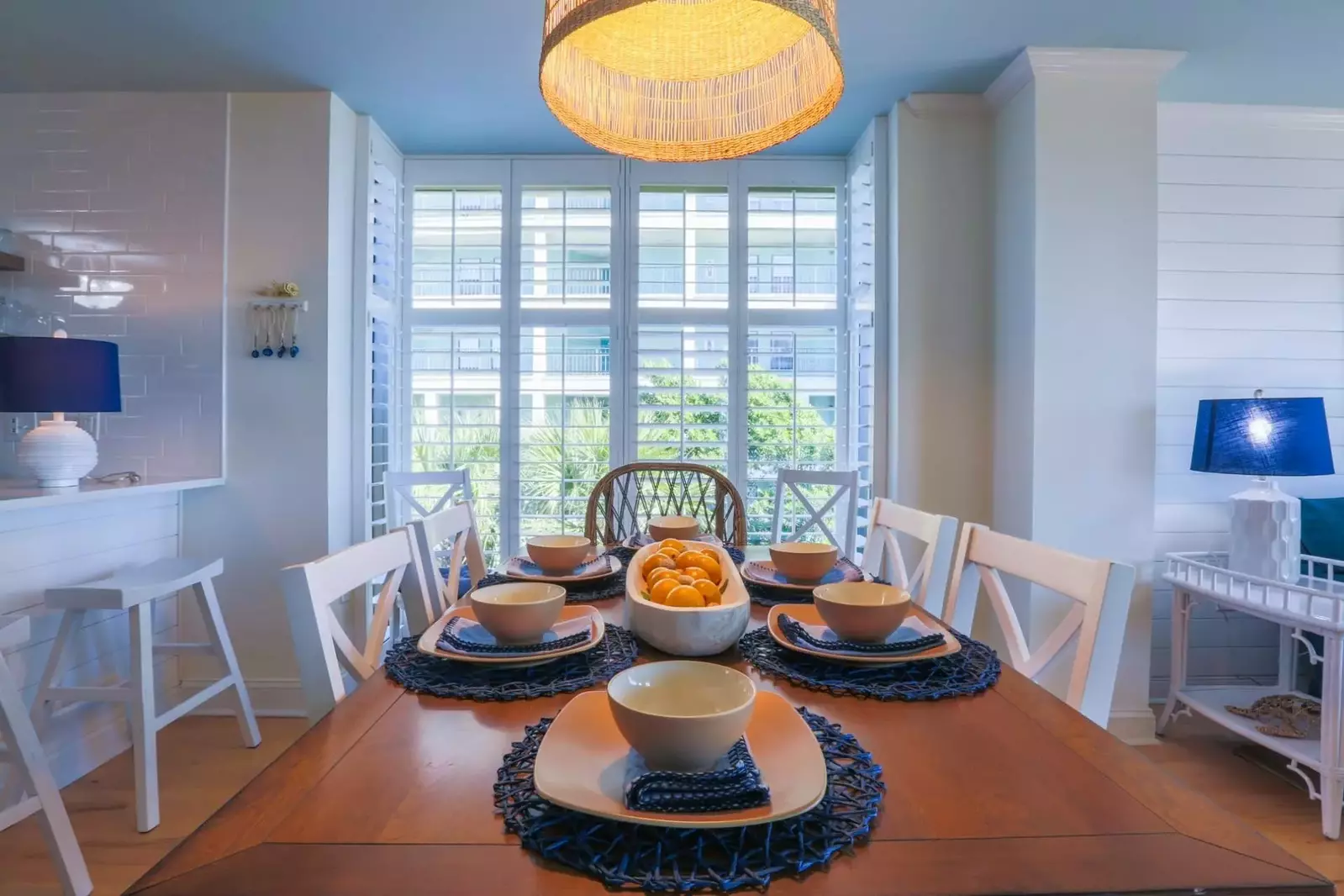 The dining table seats 8 people.  There are also 3 stools along the kitchen counter.