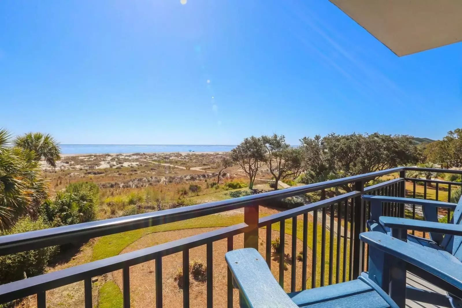 The balcony provides stunning views of the Atlantic Ocean and sand dunes.