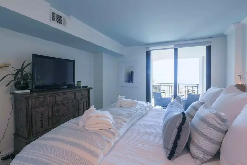 The master bedroom also has a large screen smart TV.