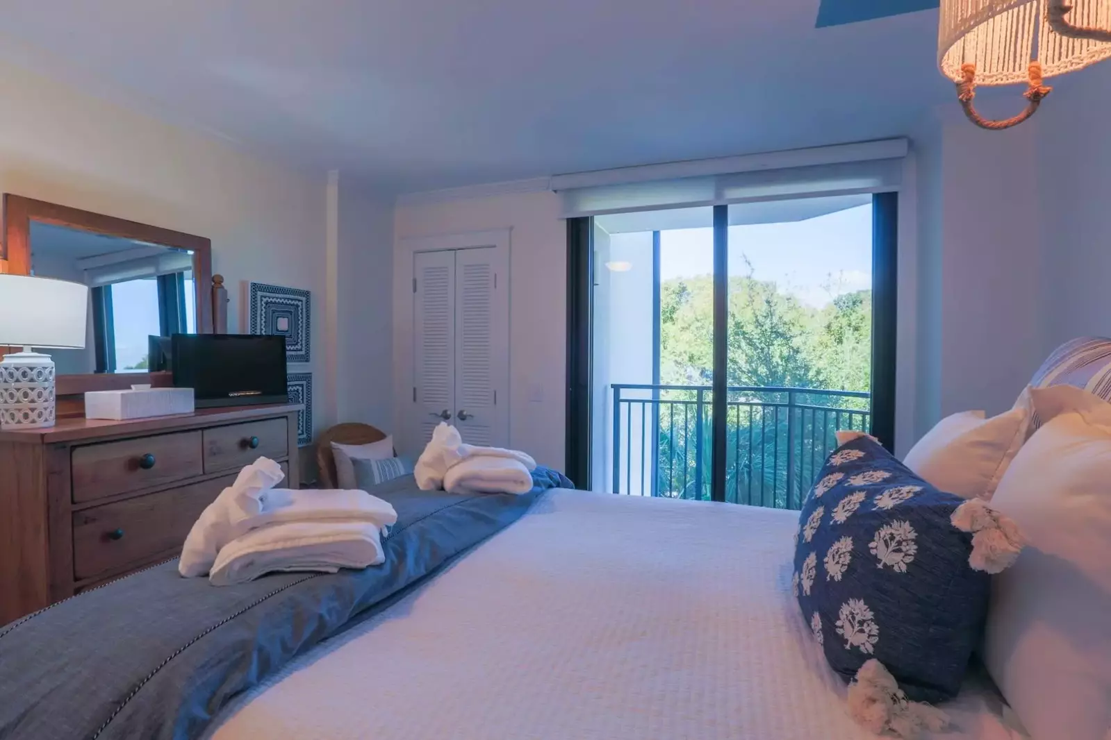 This guest bedroom has access to a private balcony that overlooks the front of the building.
