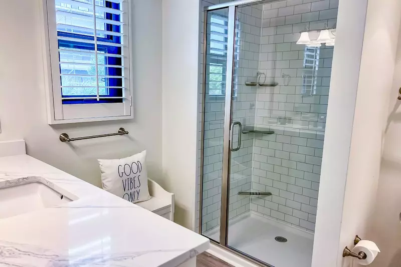 There is also a newly tiled walk-in shower in this en suite bathroom.