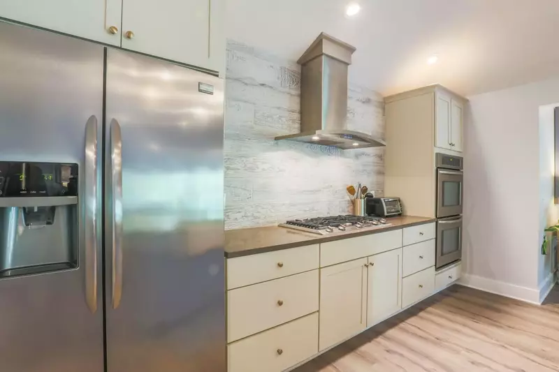 There is an oven, microwave, gas cook top, two refrigerators and a toaster oven.