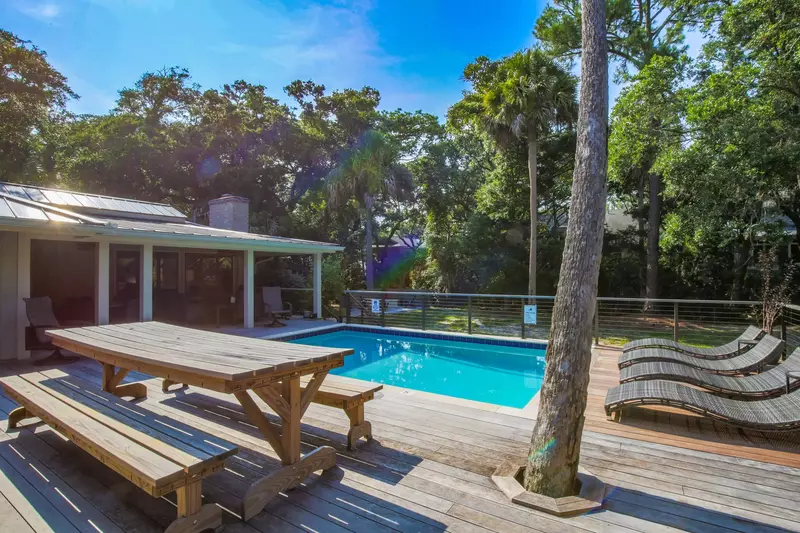 Step outside to find the private pool with lounge chairs, a covered seating area and spacious sundeck.