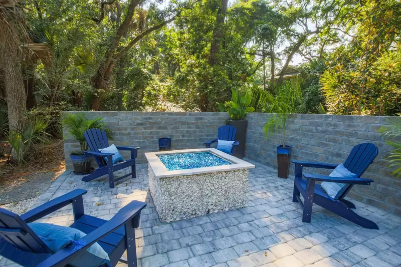 The backyard of the home features this Adirondack seating area.