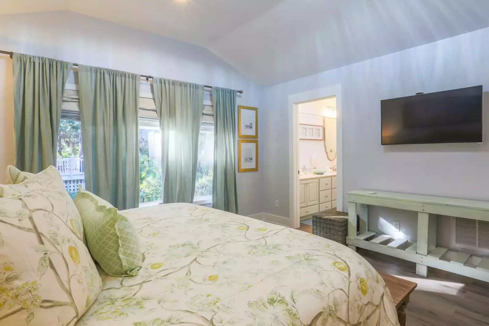 There is also a mounted smart TV and en suite bath in this master suite.
