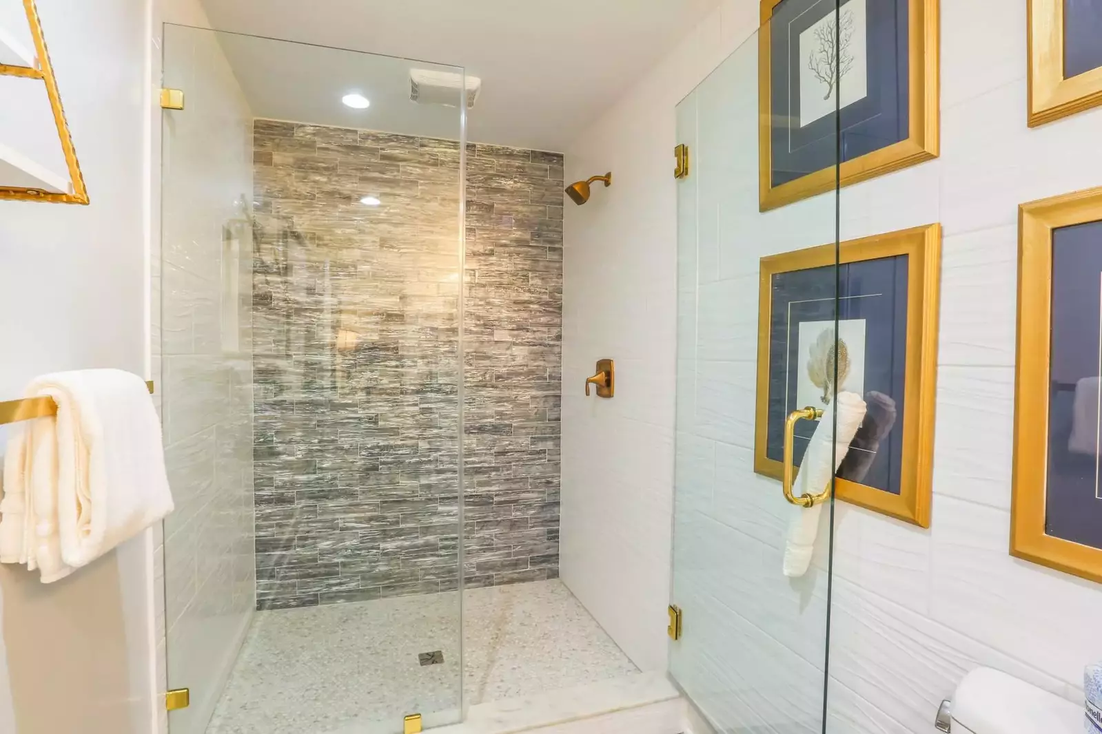 This en suite bathroom also has a gorgeously tiled walk-in shower.
