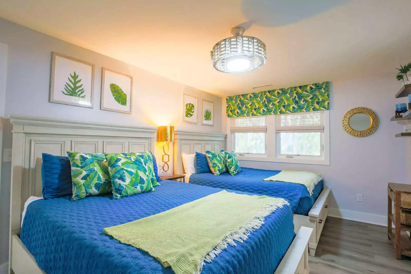 This guest bedroom has two queen beds.