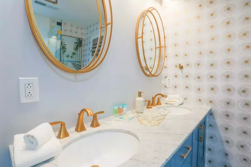 The en suite bathroom for the double queen bedroom has a double sink vanity.