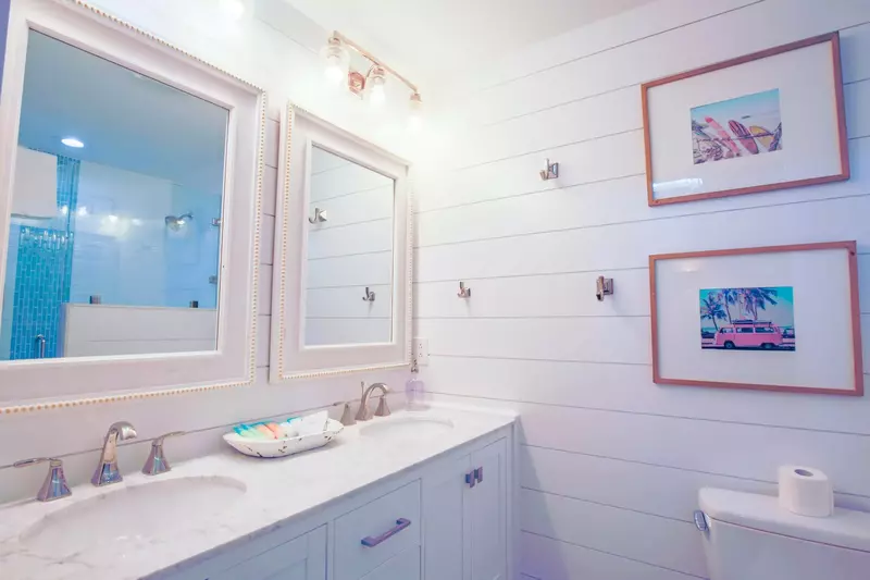 The en suite bathroom for the double full bedroom has a double sink vanity.