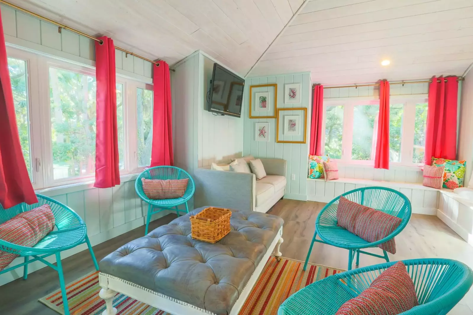 The bunk bedroom has a seating area, terrific natural light and a mounted smart TV.
