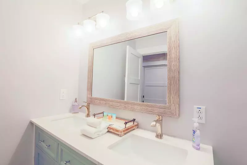 This bathroom off the hallway to the bunk bedroom features a double sink vanity.