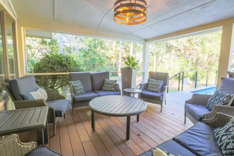 The covered portion of the back deck features this large seating area.