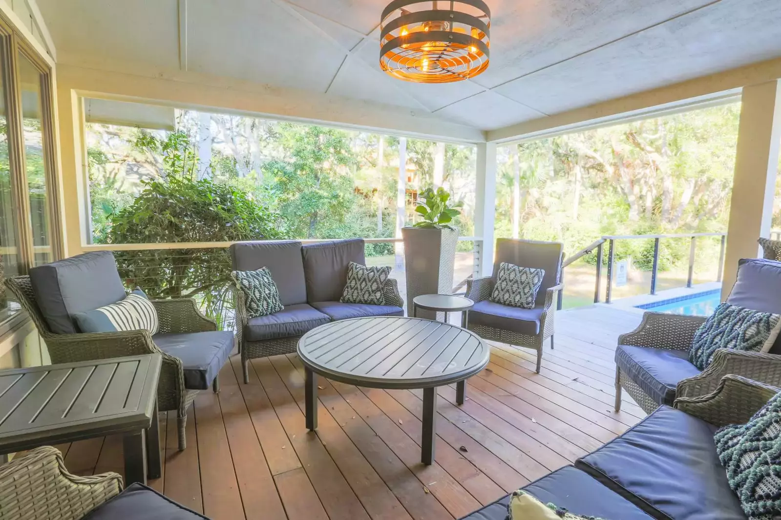 The covered portion of the back deck features this large seating area.