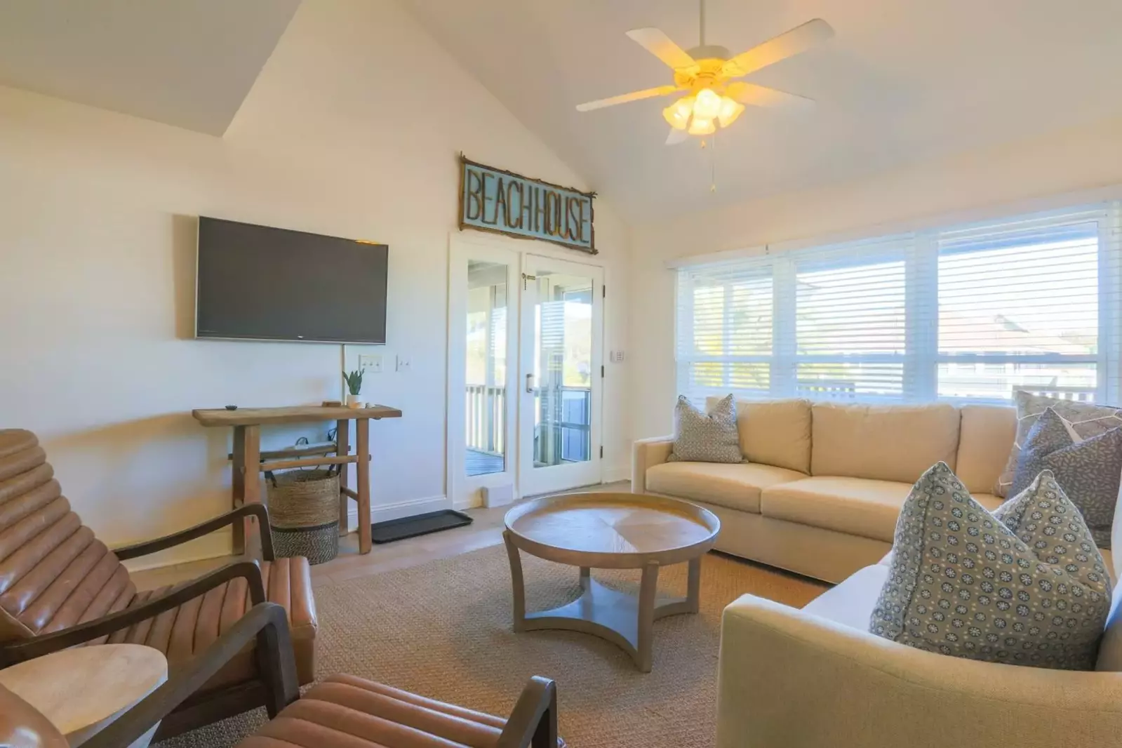When you enter the front door, you'll find the living room with vaulted ceilings and all new furniture.