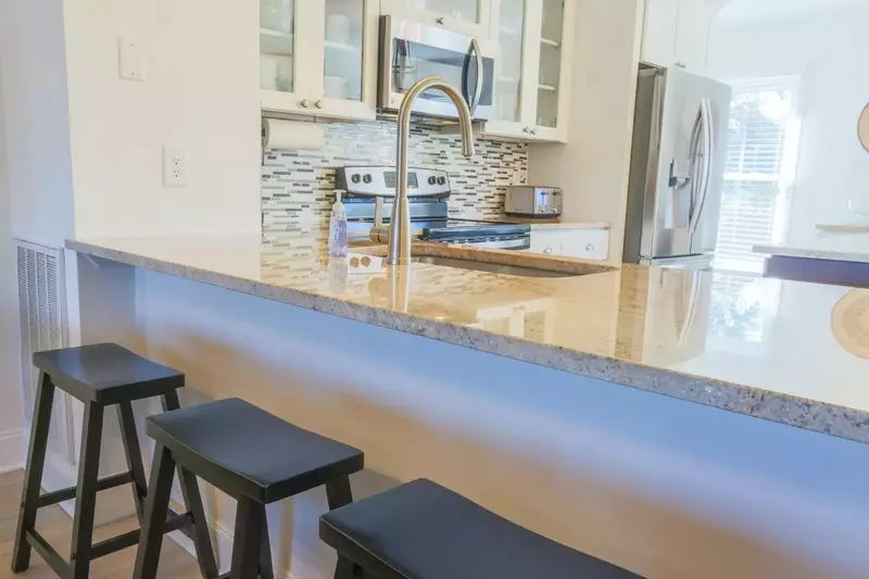 The kitchen has gorgeous granite countertops.