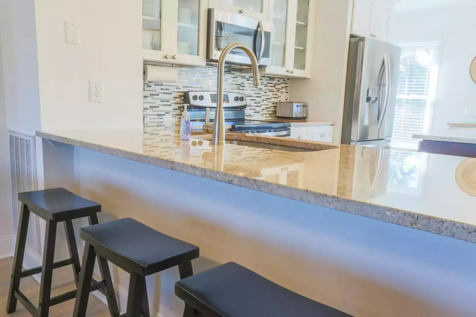 The kitchen has gorgeous granite countertops.